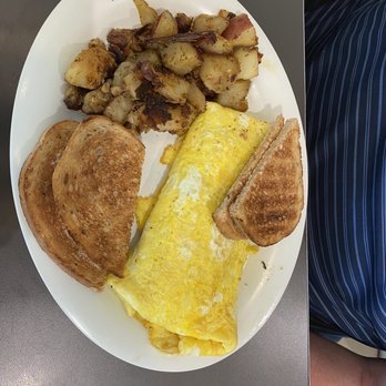 Eggs Up Grill - an omelet and potatoes on a plate - Breakfast & Brunch Near Me - Wilmington, North Carolina