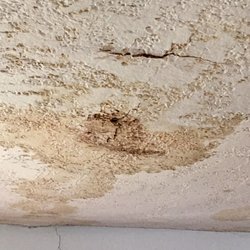 Environmental Testing Associates - Water damage on a clients living room ceiling due to a long term roof leak