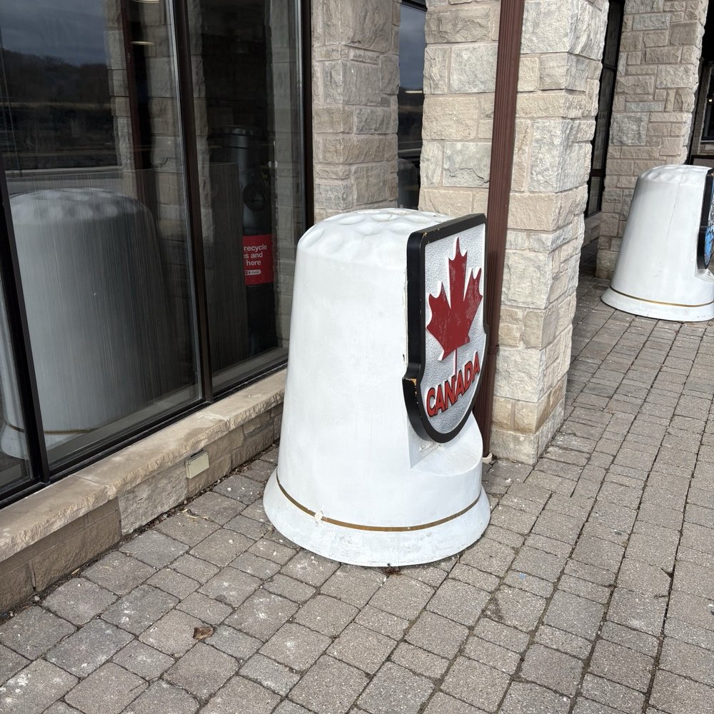 Outside of the shops, large thimbles with plaques Outside of the shops, large thimbles with plaques