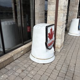 Outside of the shops, large thimbles with plaques Outside of the shops, large thimbles with plaques