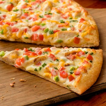 Papa Murphy's - two slices of pizza on a cutting board - Pizza Near Me - Bakersfield, California Papa Murphy's - two slices of pizza on a cutting board - Pizza Near Me - Bakersfield, California