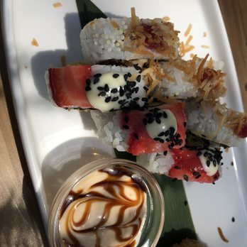 Sushi Taxi - a plate of sushi rolls with sauce - Sushi Bars Near Me - Montreal, Quebec Sushi Taxi - a plate of sushi rolls with sauce - Sushi Bars Near Me - Montreal, Quebec