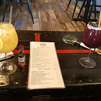 THE WINE LIBRARY BARTOW - Kumquat Sangria and Very Berry Sangria served on our cozy Trunk Table - Great drinks and atmosphere. - Wine Bars Near Me - Bartow, Florida THE WINE LIBRARY BARTOW - Kumquat Sangria and Very Berry Sangria served on our cozy Trunk Table - Great drinks and atmosphere. - Wine Bars Near Me - Bartow, Florida