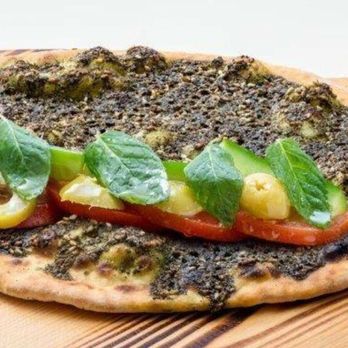 Shawarma Station - a pizza on a cutting board - Fast Food Near Me - Ottawa, Ontario Shawarma Station - a pizza on a cutting board - Fast Food Near Me - Ottawa, Ontario
