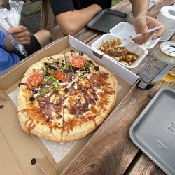 Dépanneur Jean-Marie Gravel - We ordered the 1/2 vegetarian 1/2 smoked meat pizza, poutine, and onion rings.