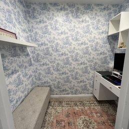 He successfully hung the shelf on the left and the box shelves on the right.