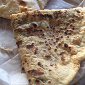 Naan N Masala - Aloo Paratha - Wheat griddle bread stuffed with spiced potatoes - Indian Near Me - Milpitas, California Naan N Masala - Aloo Paratha - Wheat griddle bread stuffed with spiced potatoes - Indian Near Me - Milpitas, California