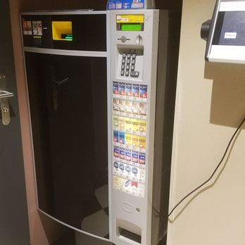 Spiga - A cigarette dispenser next to the restrooms - Italian Near Me - Zürich, ZH