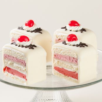 Lutz Cafe & Pastry Shop - Lutz Signature Marzipan Torte. Vanilla cake, raspberry mousse, cake soaked in cherry rum, marzipan frosting - Bakeries Near Me - Chicago, Illinois Lutz Cafe & Pastry Shop - Lutz Signature Marzipan Torte. Vanilla cake, raspberry mousse, cake soaked in cherry rum, marzipan frosting - Bakeries Near Me - Chicago, Illinois