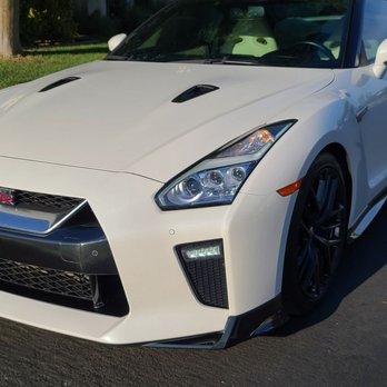 Front bumper & bottom trim pieces around car were wrapped in wet carbon fiber. Superb contrast in comparison to the factory stock color.