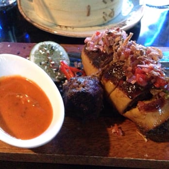 Blue Kanu - Special, not on menu (yet) squid stuffed with meat, with red capsaicin/coconut sauce, small plate, $24 - Asian Fusion Near Me - Queenstown, OTA