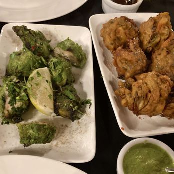 Hungry Elephant Bar & Grill - Hariyali Tikka (Chicken) and Veg pakoras with mint sauce in the front - Indian Near Me - Visalia, California