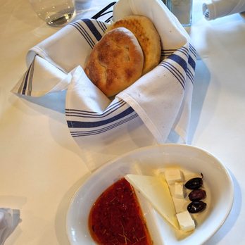 Mandolin Kitchen - Complimentary bread, cheeses, and olives. And psst. That triangular piece is butter. - Mediterranean Near Me - Atlanta, Georgia