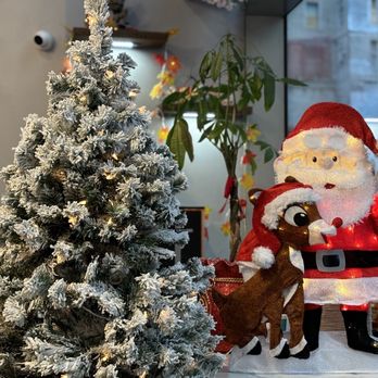 Wolf Forest Cafe - a santa and his reindeer - Cafes Near Me - New York, New York