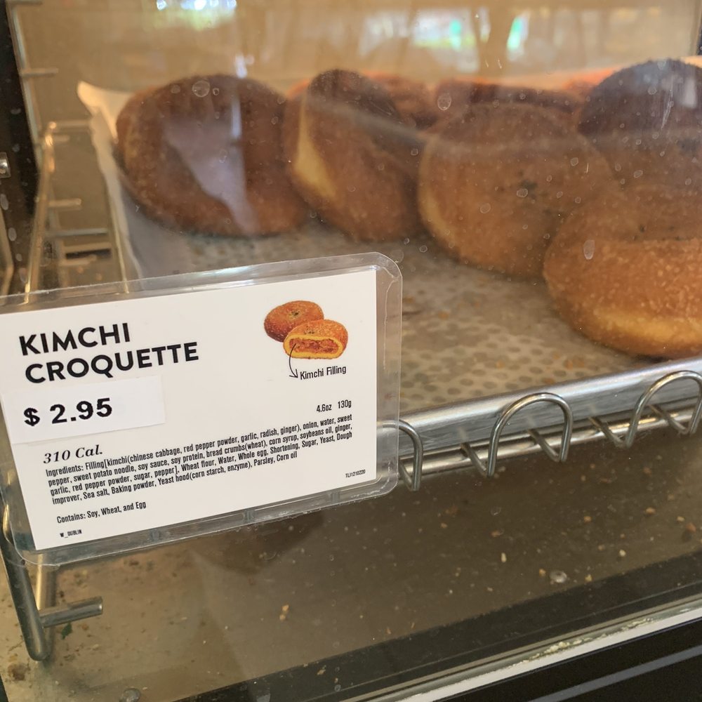 Kimchi Croquette indicated w.black sesame seeds on top Kimchi Croquette indicated w.black sesame seeds on top