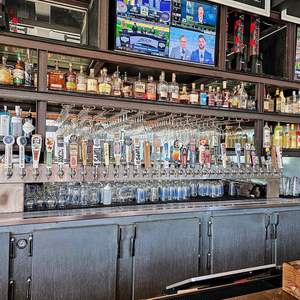 a bar with a variety of liquors a bar with a variety of liquors