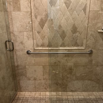 San Diego Grab Bars - Grab bar installed in shower with travertine tile. - General Contractors Near Me San Diego Grab Bars - Grab bar installed in shower with travertine tile. - General Contractors Near Me