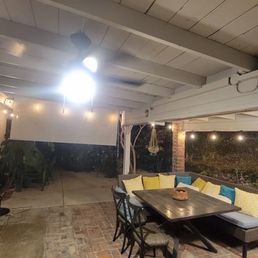 Patio fan, roll up shades and bistro lighting. Patio fan, roll up shades and bistro lighting.