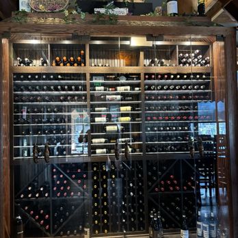 Enzo’s Bistro & Bar - Killer wine cellar at the front door entrance. Bar to right, dining room to left. - Italian Near Me - Issaquah, Washington Enzo’s Bistro & Bar - Killer wine cellar at the front door entrance. Bar to right, dining room to left. - Italian Near Me - Issaquah, Washington