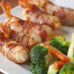 Palenque Grill - Camarones Laredo
Jumbo Shrimps stuffed with cheese and jalapeños wrapped in bacon, served with rice and steamed vegetables
