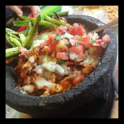 Molecajete in this traditional stone vessel is by far the best thing ever. Our favorite to share with two people. Nom.