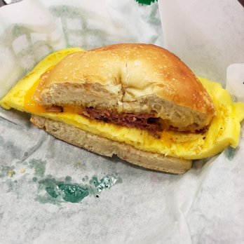 Greenfields NY Deli & Bagels - Egg, pastrami, and cheddar on a plain bagel. - Bakeries Near Me - Greensboro, North Carolina