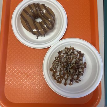 Desert Donuts - Top left: maple Nutella, lower right: pumpkin spice powder sugar with Carmel drizzle and pecan pieces. - Donuts Near Me - Phoenix, Arizona