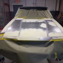 631 Auto Body - Hood stripped to bare metal.