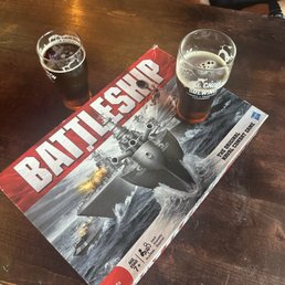 Beers and Battleship while waiting for a seat to open up outside. Beers and Battleship while waiting for a seat to open up outside.