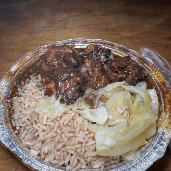 Paradise Island Grill - Oxtails with rice and peas & cabbage - Seafood Near Me - Temple Hills, Maryland Paradise Island Grill - Oxtails with rice and peas & cabbage - Seafood Near Me - Temple Hills, Maryland
