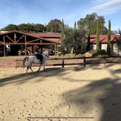 Hidden Hills Equestrian Ranch - Main arena looking at main barn