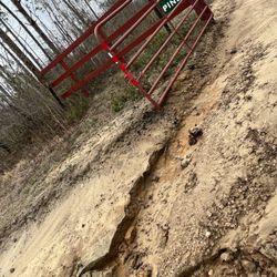 Blue Sky Landscaping and Design - Driveway at gate, impossible to drive in after "driveway repair" job.