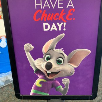 Chuck E. Cheese - a sign that says have a chucke day - Pizza Near Me - Boynton Beach, Florida