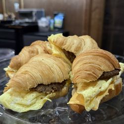 Two LaFonds Coffee - Sausage, egg & cheese croissant sandwiches.