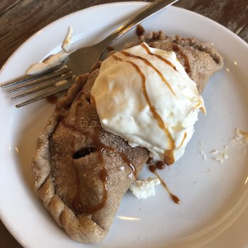 Chala's Wood Fire Grill - Warmed apple empanada with house made whipped cream. - Mexican Near Me - Mesilla, New Mexico