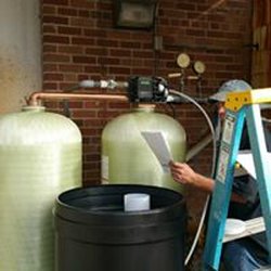 Captain Solutions Servicing Commercial Water Softener.
