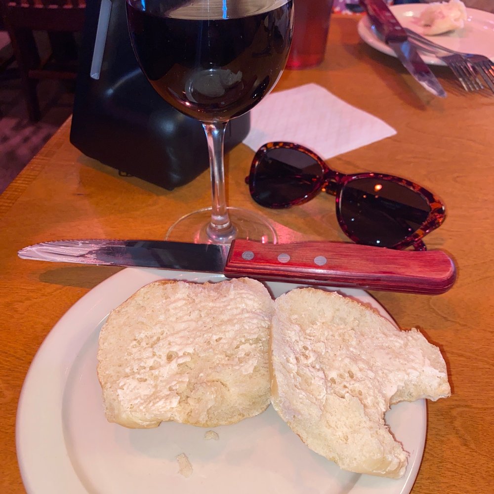 Texas Roadhouse - A glass of Pinot Noir and a roll - American Near Me - Joliet, Illinois Texas Roadhouse - A glass of Pinot Noir and a roll - American Near Me - Joliet, Illinois