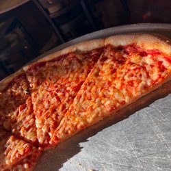 Ciro's Pizza - Cheese pizza as the late afternoon lights hits through the window