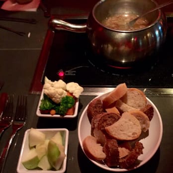 The Melting Pot - Cheese fondue dippers; bread, veggies, and green apples - Fondue Near Me - Austin, Texas The Melting Pot - Cheese fondue dippers; bread, veggies, and green apples - Fondue Near Me - Austin, Texas