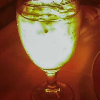 Geja's Cafe - A back lit glass of water even takes on a romantic artsy feel. - Fondue Near Me - Chicago, Illinois