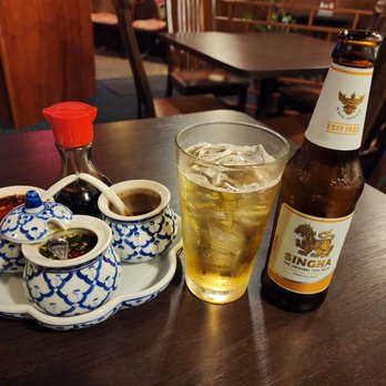 Thai Wok - a glass of beer and a plate of food - Thai Near Me - Saint Petersburg, Florida Thai Wok - a glass of beer and a plate of food - Thai Near Me - Saint Petersburg, Florida