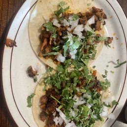 Alpastor tacos with onion & cilantro