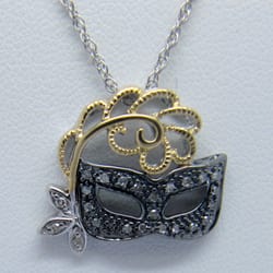 The Jewelry Design Company - Strerling, 14k yellow gold and diamond mask pendant.