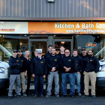 Harb Plumbing - a group of people standing in front of a kitchen and bath showroom - Plumbing Near Me - Milton, Ontario Harb Plumbing - a group of people standing in front of a kitchen and bath showroom - Plumbing Near Me - Milton, Ontario