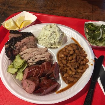 Roegels Barbecue - Brisket, pulled pork, & hot sausage with pinto beans and potato salad. Pretty filling considering my husband and I shared this! - Barbeque Near Me - Houston, Texas Roegels Barbecue - Brisket, pulled pork, & hot sausage with pinto beans and potato salad. Pretty filling considering my husband and I shared this! - Barbeque Near Me - Houston, Texas
