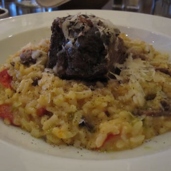 Vivace - Short ribs with risotto, butternut squash, sun-dried tomatoes, and rosemary oil. - Italian Near Me - Raleigh, North Carolina Vivace - Short ribs with risotto, butternut squash, sun-dried tomatoes, and rosemary oil. - Italian Near Me - Raleigh, North Carolina