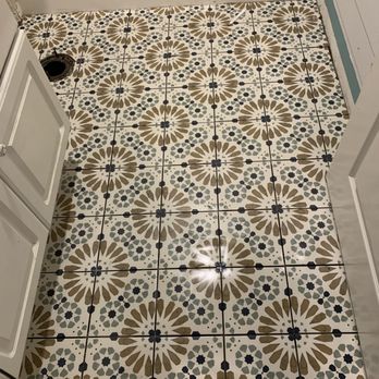 V is Handy - a bathroom with a tiled floor - Painters Near Me