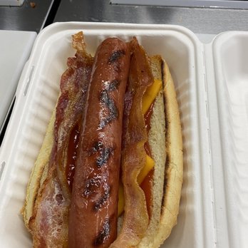 Burger Madness - Monroe - Hot dog with ketchup and bacon strips - Burgers Near Me - Monroe, Washington Burger Madness - Monroe - Hot dog with ketchup and bacon strips - Burgers Near Me - Monroe, Washington
