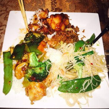Garden China - General Tso's Chicken (top of plate), Fried Rice underneath, Chow Mein Fun (noodles), and Hunan Shrimp (left side of the plate) - Chinese Near Me - Bolingbrook, Illinois Garden China - General Tso's Chicken (top of plate), Fried Rice underneath, Chow Mein Fun (noodles), and Hunan Shrimp (left side of the plate) - Chinese Near Me - Bolingbrook, Illinois