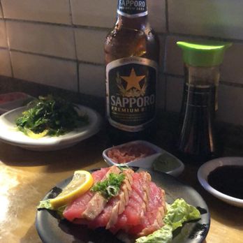Katana - First plates: Seared tuna sashimi, seaweed salad & Sapporo. - Sushi Bars Near Me - Miami Beach, Florida Katana - First plates: Seared tuna sashimi, seaweed salad & Sapporo. - Sushi Bars Near Me - Miami Beach, Florida